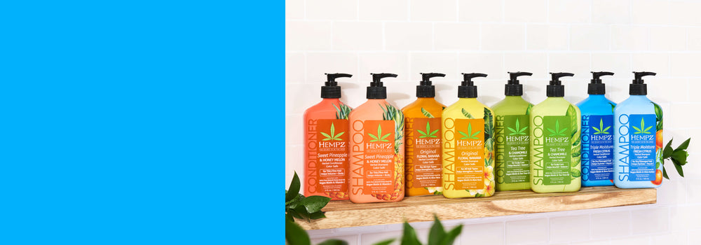 Hempz hydrating haircare on a wooden shelf with leaves