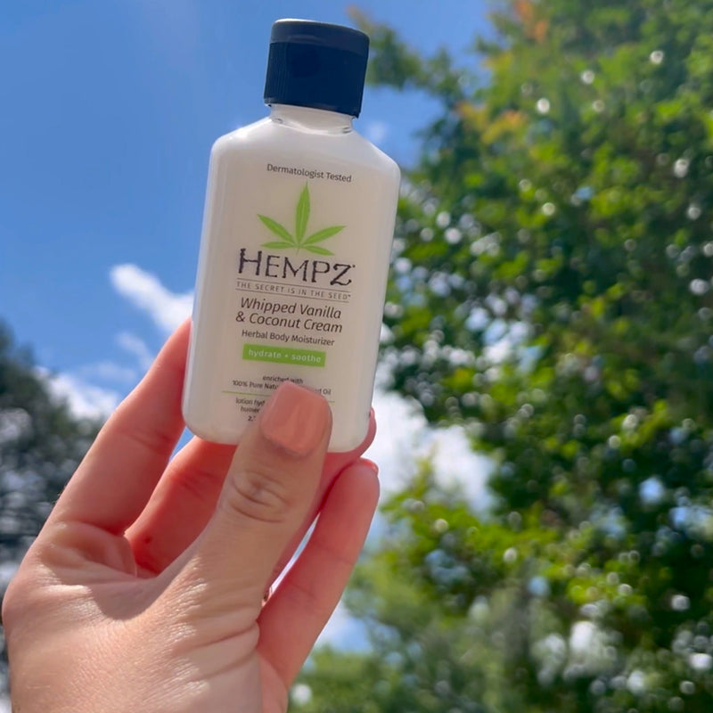 Hempz Travel-Size Whipped Vanilla & Coconut Cream Herbal Body Moisturizing Lotion against the sky