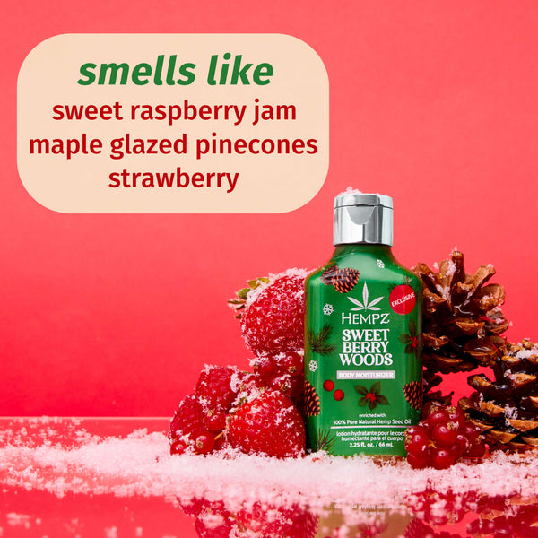 Hempz Sweet Berry Woods product with berries and pinecones on a red background