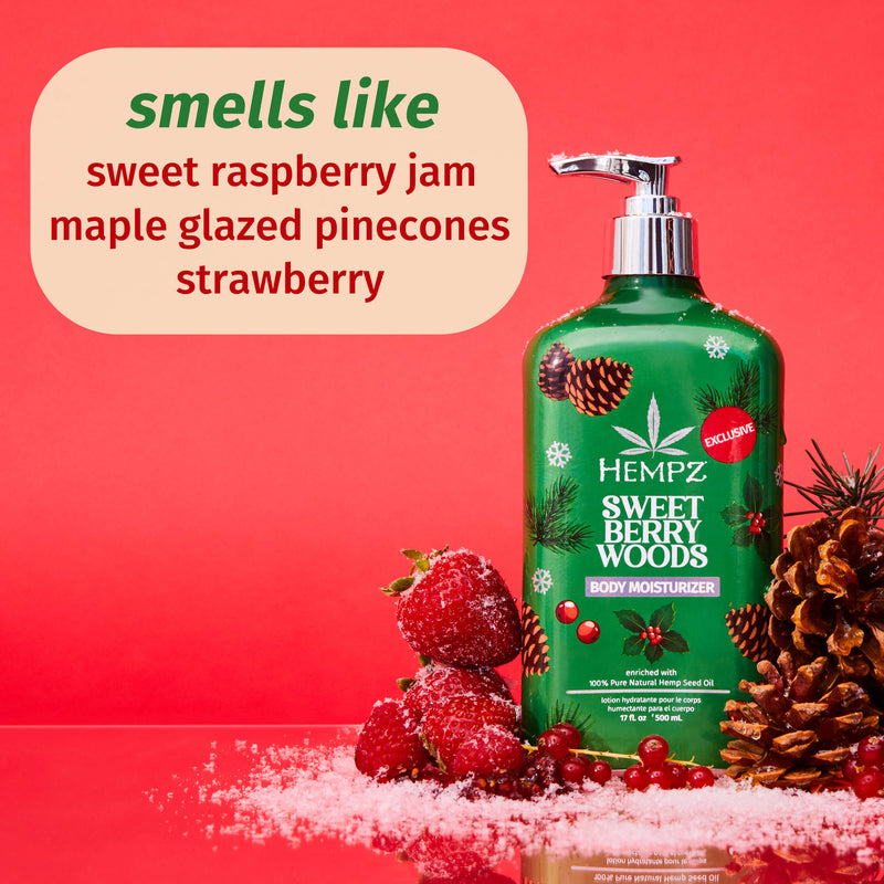 Hempz Sweet Berry Woods moisturizer bottle with berries and pinecones on a red background