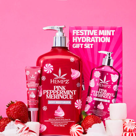Hempz Festive Hydration gift set including lotion and lip balm, with marshmallows, strawberries, and peppermints