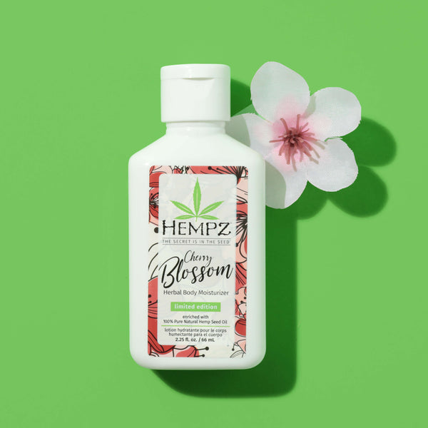 Hempz Travel-Size Cherry Blossom Herbal Body Moisturizer with flower